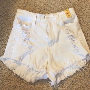 White ripped shorts